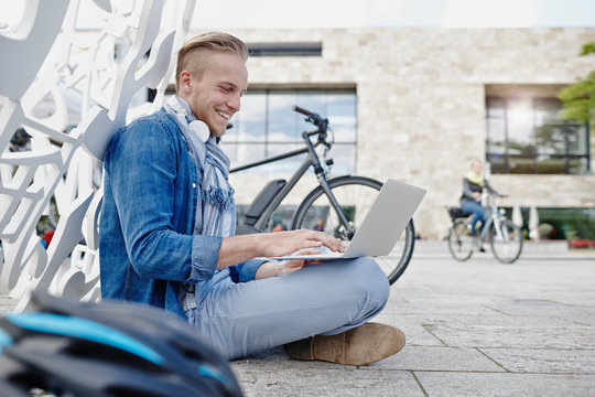 Student using laptop at Goethe University in Frankfurt, Germany