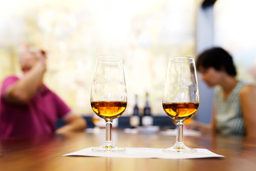 wine tasting sampling with couple drinking , selective focus on wine glasses , Madeira island