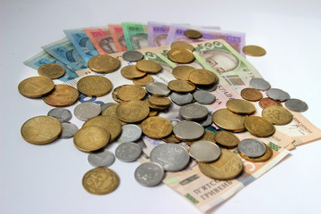 Ukrainian money hryvnia on the white background. The national currency. 5, 10, 20, 50, 500 bill or banknote and coins. Corruption in Ukraine