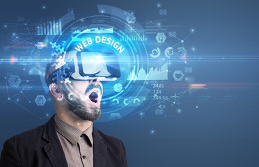Businessman looking through Virtual Reality glasses with WEB DESIGN inscription, innovative technology concept