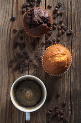 Fototapeta na wymiar Two muffins and coffee cup