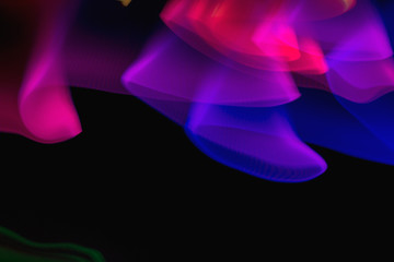 Pattern of colorful, energetic lights on a dark background