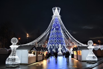 Vilnius, Lithuania - December 9 2019: Beautiful Christmas tree decorated with white and blue lights...