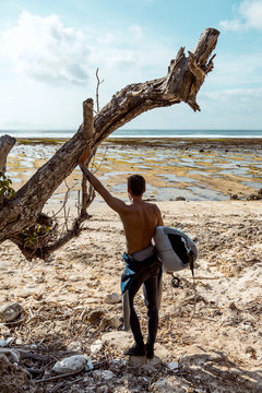 Surfer looking at wave