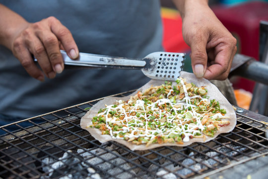 Close up of a seafood pancake made on the street in Hoi An, Vietnam.