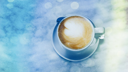 Top view of coffee in blue cup on table