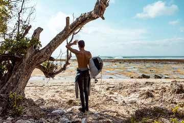 Surfer looking at wave
