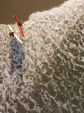 Aerial view of surfers at the beach