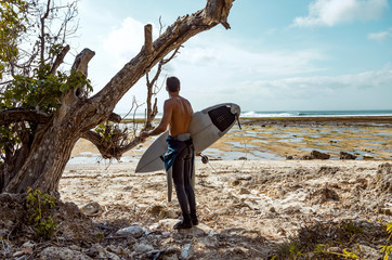 Surfer looking at wave