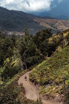 One man walking on the road in mountain