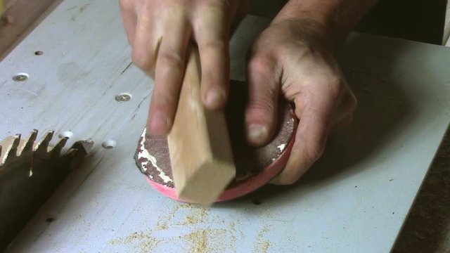 In carpentry stodio workplace. Wood processing woodworking close-up. Process of creating  handmade wooden product.