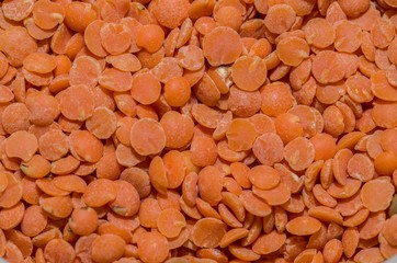 Background with red lentils in the foreground