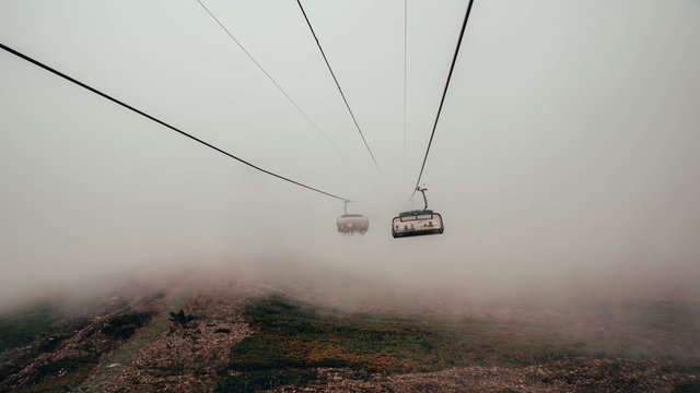 Cable car in the foggy forest