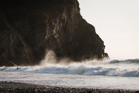Cornish Coastline Surfer Entering Waves
