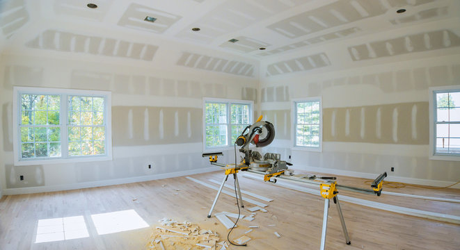 Construction Remodeling Home Cutting Wooden Trim With Circular Saw.