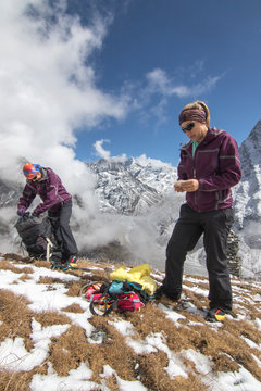 Mother and daughter mountaineers pack their bags