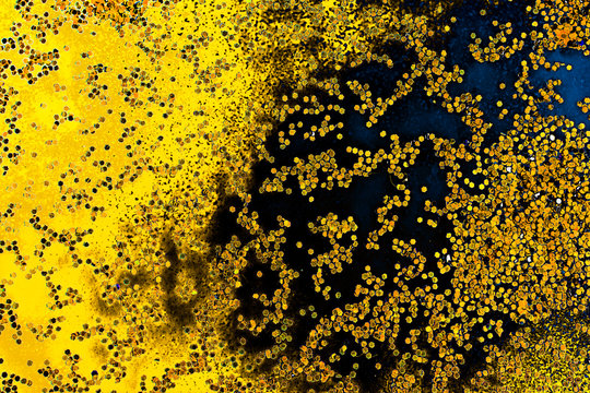 Macro shot of water oil emulsion over colored background