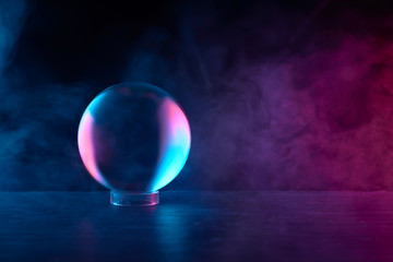 crystal ball in red-blue smoke