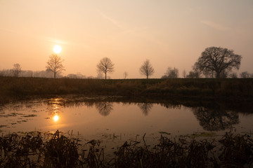 magic light in rural landscape at sunrise