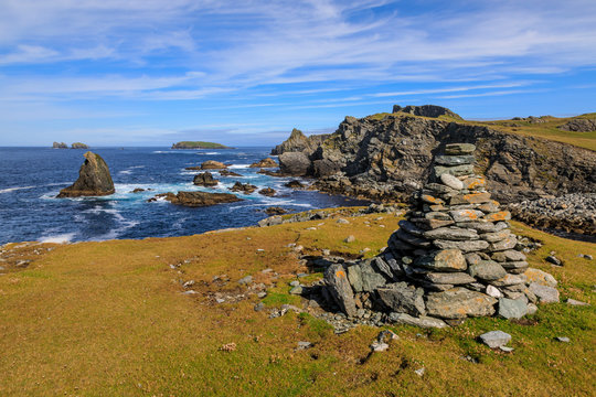 Isle of Fethaland, lichened cairn, cliffs, stacks, Isle of Gruney, Ramna Stacks, North Roe, Mainland, Shetland Isles, Scotland