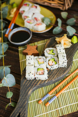 sushi with salmon and avocado. Sushi roll with salmon and tempura shrimp
