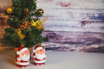 Fir tree for New Year and Christmas decorated with toys and Santa Claus.