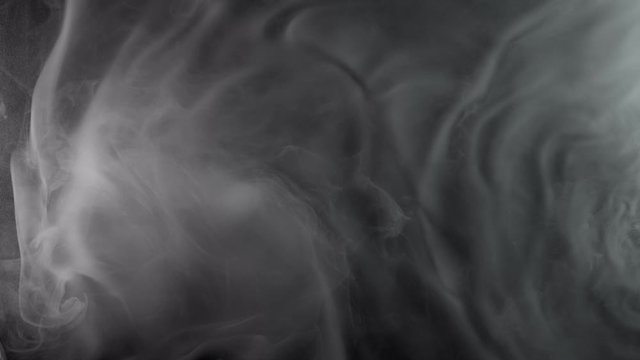Slow motion of white smoke effect. Filmed on high speed cinema camera