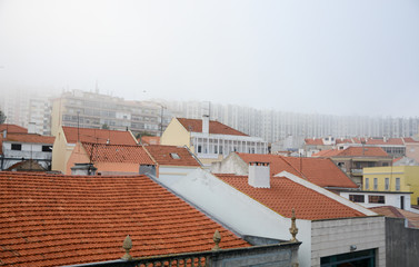 City in the morning fog