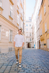 Young man background the old european city take selfie