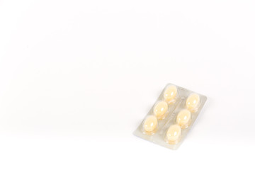 Tablets in strip over white background, vaginal antibacterial capsules