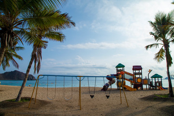 Swing on the beach by the ocean