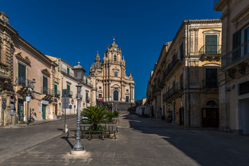 Fototapeta na wymiar View of the baroque church San Giorgio and the empty square Piazza Duomo in the historical center of Ragusa Ibla in Sicily, Italy
