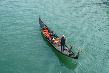 Obraz premium Tourists in gondolas on canal of Venice.
