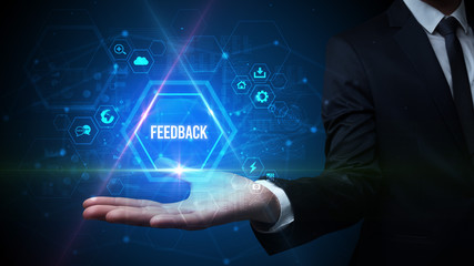 Man hand holding FEEDBACK inscription, social media concept
