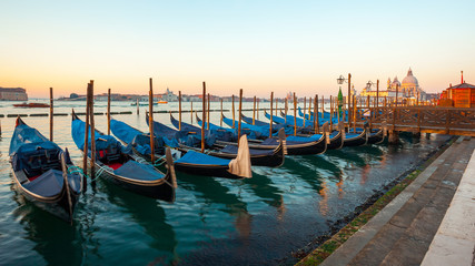 Gondolas by Saint Mark square at sunrise, Venice, Italy