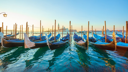 Sunrise at Venice with gondola and island of st george view from the square San marco © k_samurkas