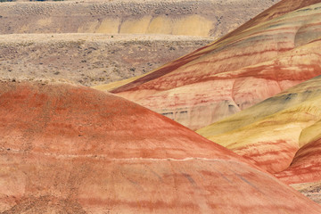 Fototapeta na wymiar Detail of the arid, wavy and colorful landscape of Painted Hills