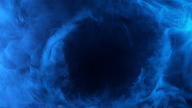 Slow motion of coloured smoke effect with revealing circle. Filmed on high speed cinema camera