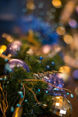 Close up Christmas tree decorated with blue ornaments and lights, xmas decorations
