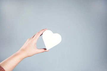 woman hand holding heart