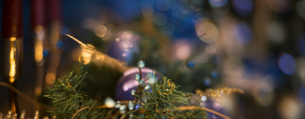 Close up Christmas tree decorated with blue ornaments and lights, xmas decorations. Banner