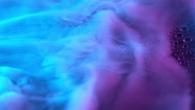 Slow motion of coloured smoke effect with neon lights. Filmed on high speed cinema camera 