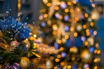 Close up Christmas tree decorated with blue ornaments and lights, xmas decorations