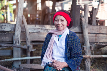 Portrait of Asian senior adult woman smiling in countryside of Thailand