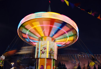 Rotating carousel, A long exposure of a carnival ride, Christmas market, Christmas lighting in...