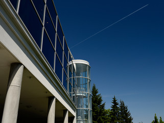 Jet vapor trail and Ontario Association of Architects building Toronto Canada
