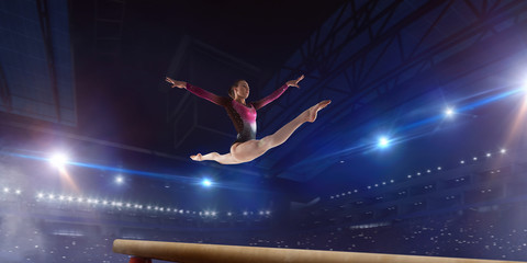 Obraz na płótnie Canvas Female gymnast on professional arena.