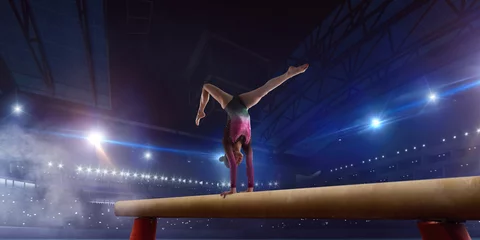 Zelfklevend Fotobehang Female gymnast on professional arena. © Victoria VIAR PRO
