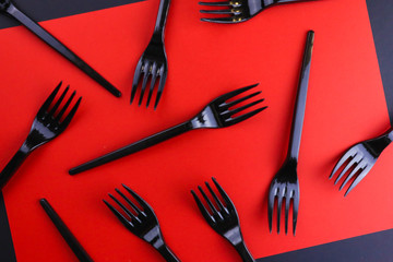 Black forks on red background.