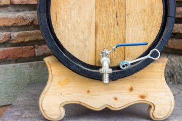 Wooden wine barrel with a tap. traditional concept of winemaking and wine tasting.